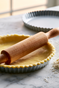 Press or roll the dough into a 9-inch tart pan, trimming any excess