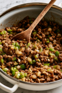 Stir in the diced onion, bell pepper, and garlic