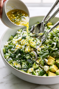 dd the sliced shallot, crumbled feta, fresh dill, chives, basil, and diced avocado,