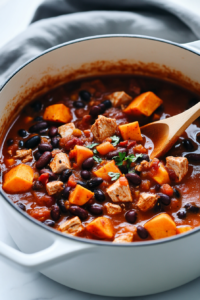 Add the sweet potatoes, diced tomatoes, black beans