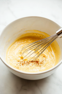 Whisk together the eggs, whole milk,