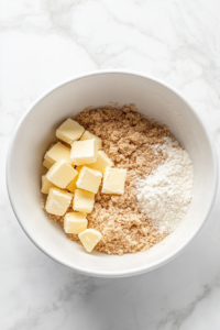Combine the flour, brown sugar, cinnamon, and salt in a bowl.