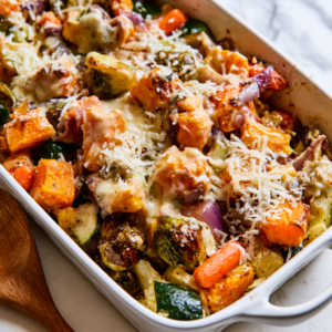 Transfer the roasted vegetables to a lightly greased baking dish