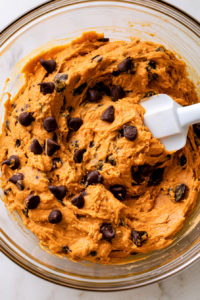 In a separate bowl, whisk together the pumpkin puree