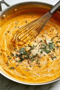 Stir in the pumpkin purée, heavy cream, and milk