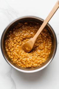 Once the oats begin to soften, mix in the maple syrup